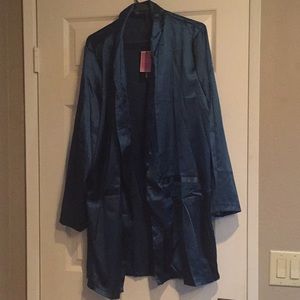 A teal silk cardigan great for a special night